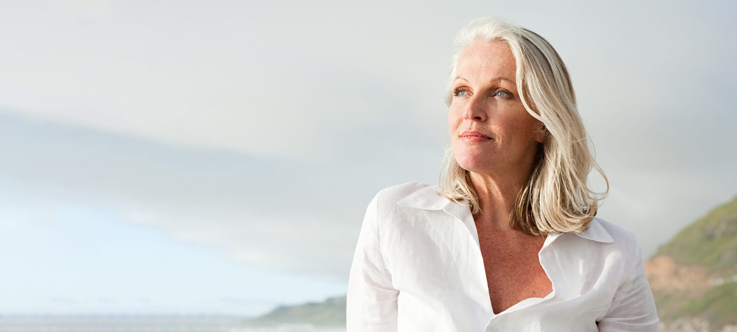 Beautiful woman with grey/white hair outside