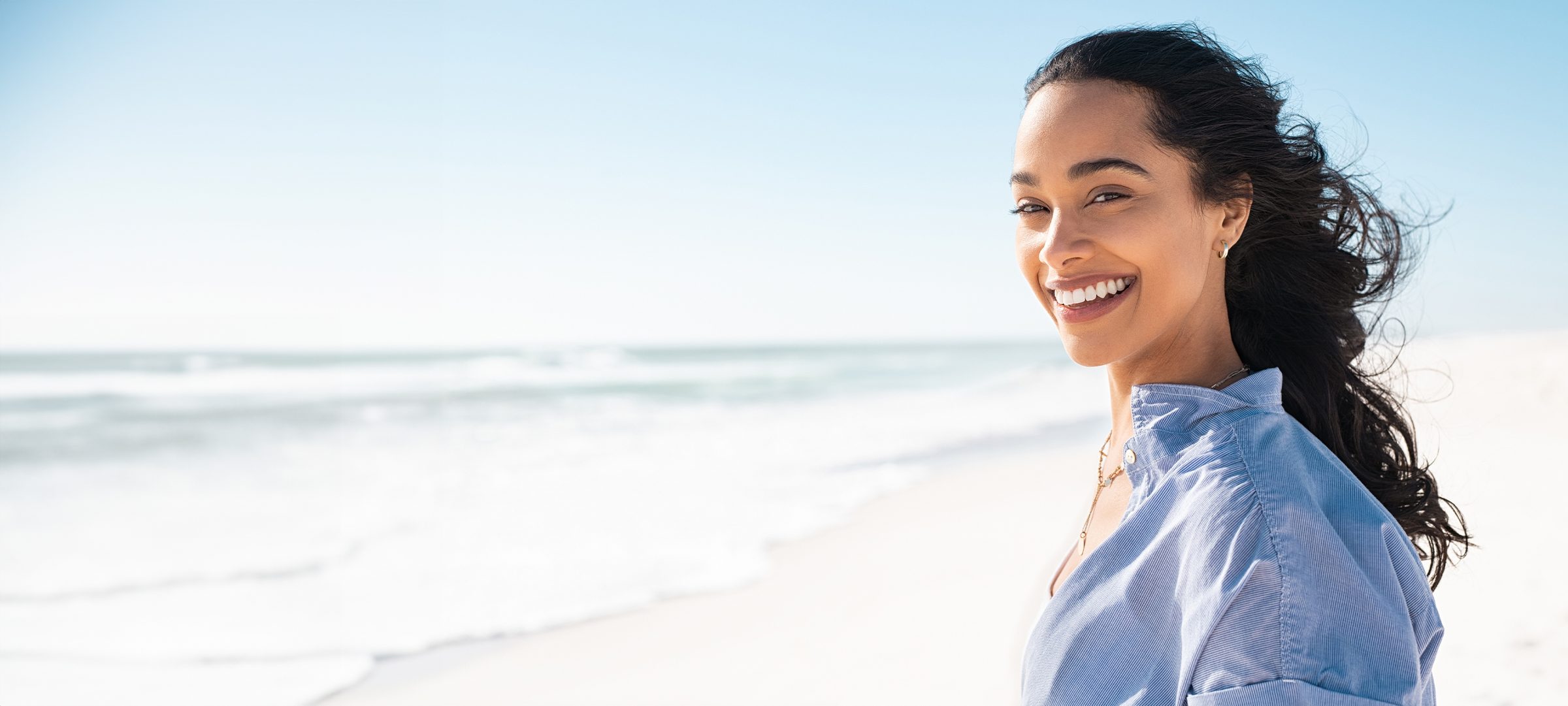 Woman smiling at the beach
