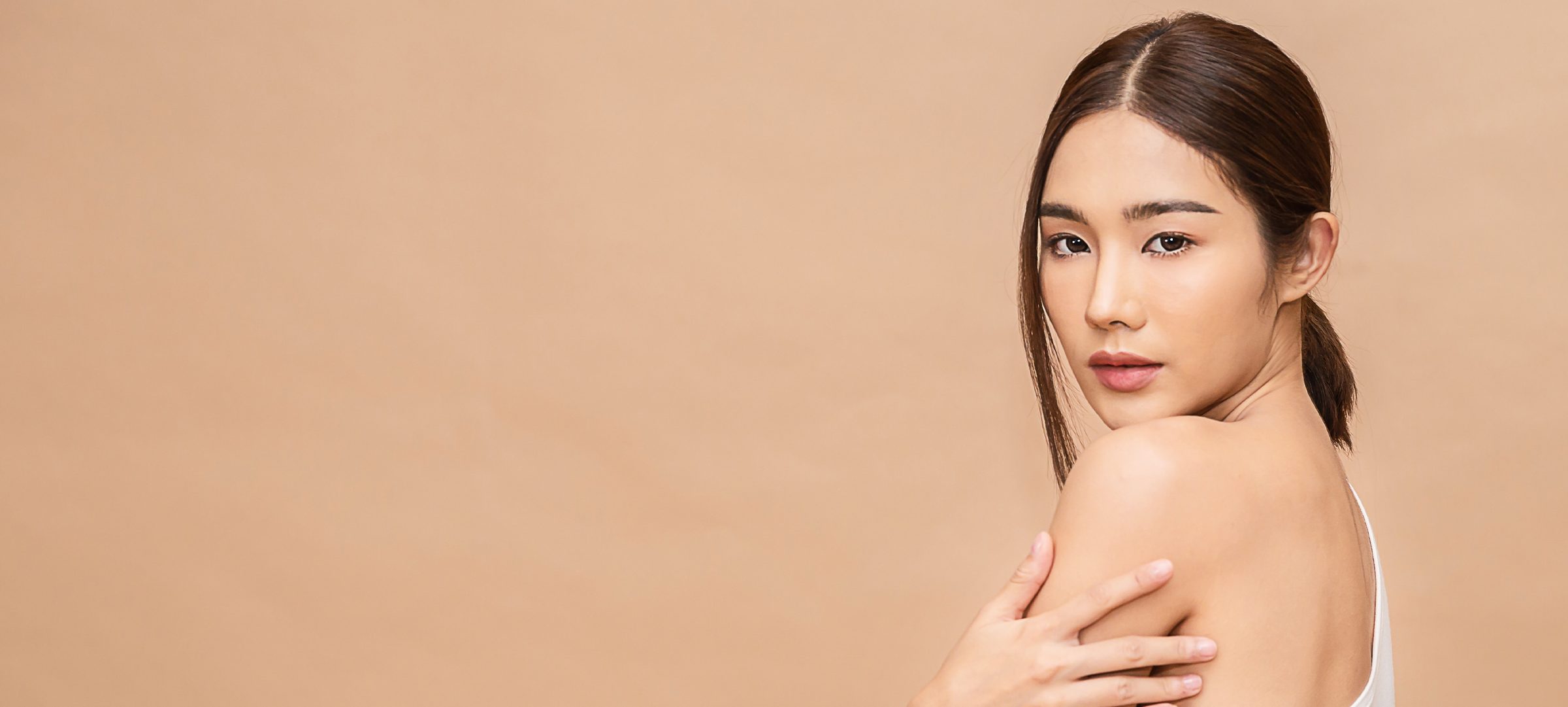 Woman with her hair pulled back in a ponytail